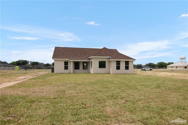 view of front of property with a front lawn