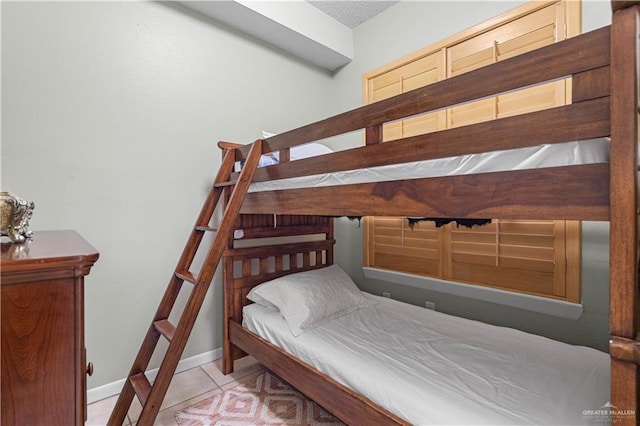 bedroom with light tile patterned floors