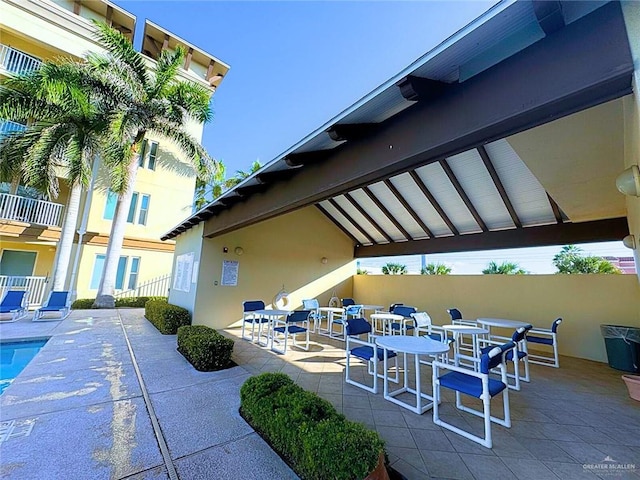 view of patio featuring a fenced in pool