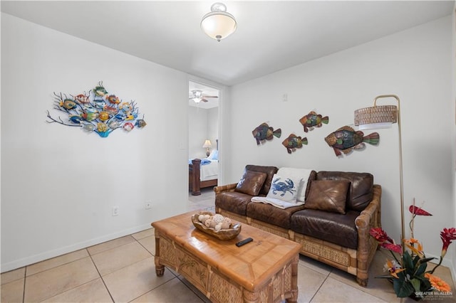 living room with ceiling fan and light tile patterned flooring