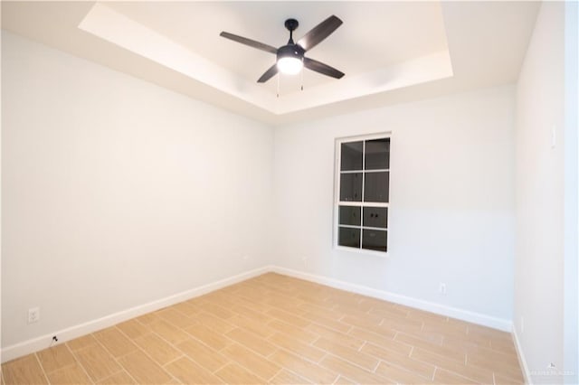1808 Diplomat Dr, Edinburg, TX 78542 - unfurnished room featuring a tray ceiling and a ceiling fan