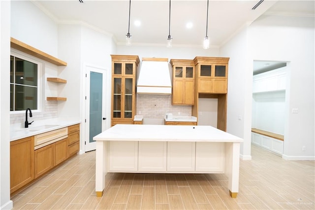 1808 Diplomat Dr, Edinburg, TX 78542 - kitchen with tasteful backsplash, crown molding, a center island, glass insert cabinets, and recessed lighting