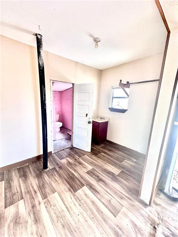 1210 SE Wright Ave SE, Pharr, TX 78577 - spare room featuring wood finished floors