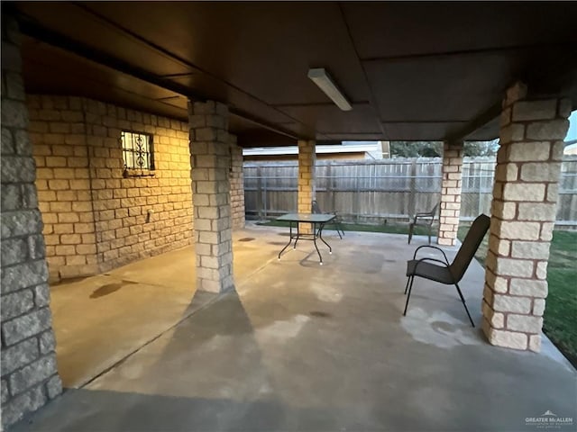 view of patio featuring fence