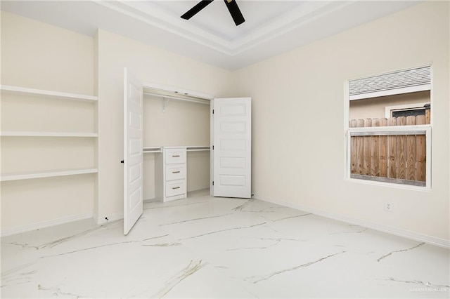 2809 E Tamarindo Ave, Hidalgo, TX 78557 - unfurnished bedroom featuring light marble finish flooring, a closet, a raised ceiling, and ceiling fan