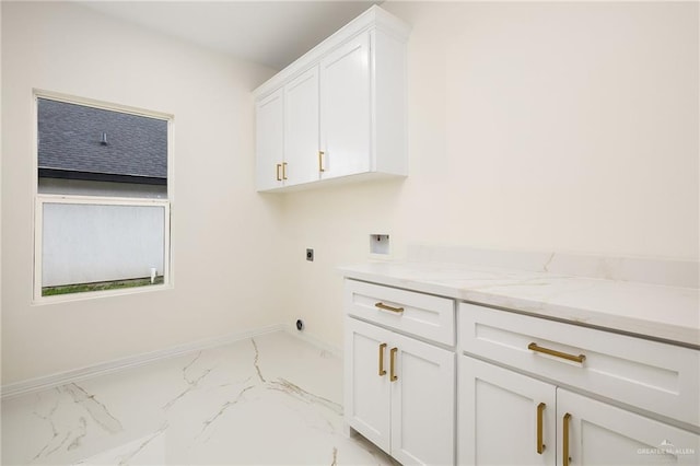 2809 E Tamarindo Ave, Hidalgo, TX 78557 - laundry room with light marble finish flooring, hookup for an electric dryer, cabinet space, and washer hookup