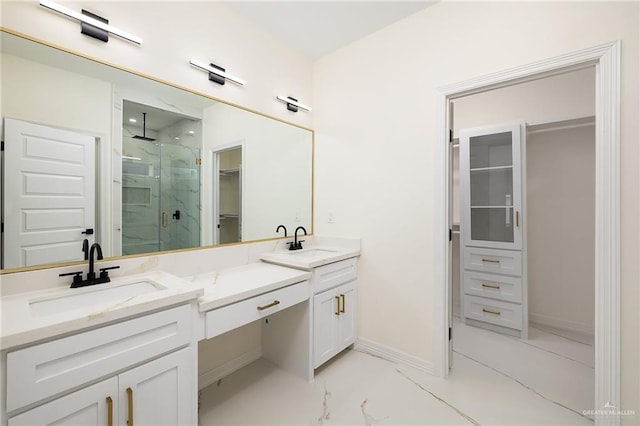 2809 E Tamarindo Ave, Hidalgo, TX 78557 - bathroom featuring a walk in closet, a marble finish shower, double vanity, and marble look tile flooring