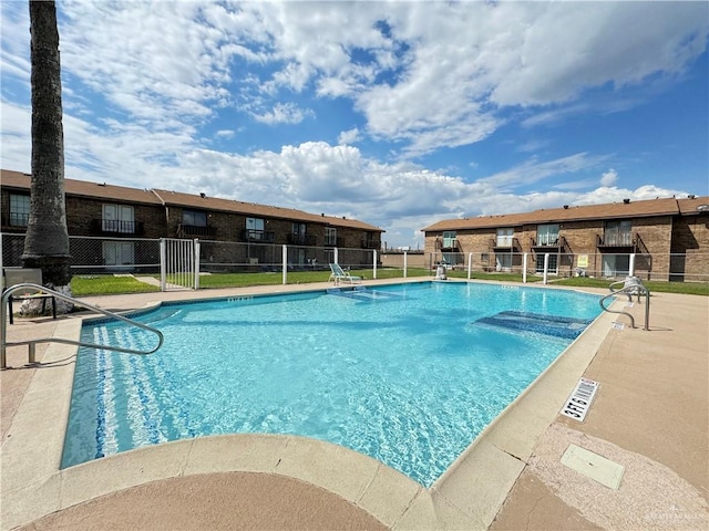 view of swimming pool with a patio area