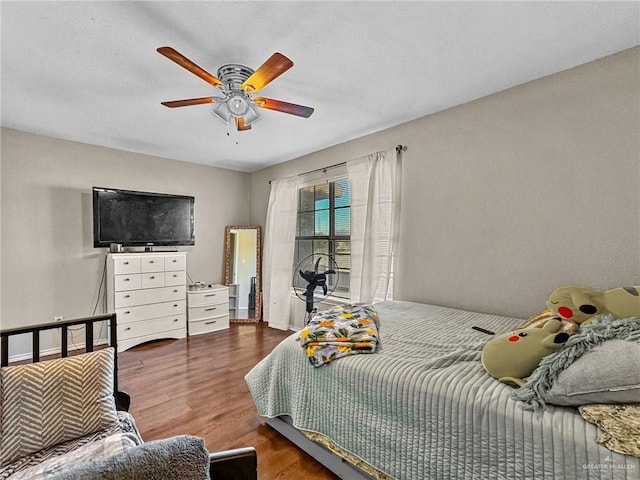 bedroom featuring ceiling fan and hardwood / wood-style floors