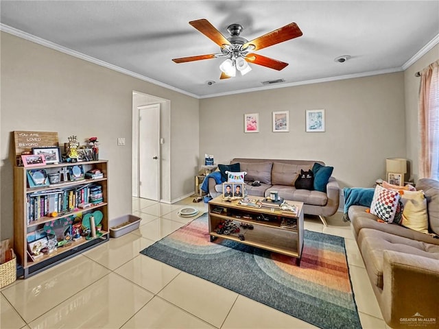 living room with tile patterned floors, ceiling fan, and crown molding