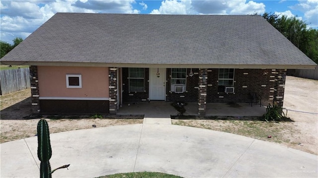 view of front of home featuring a porch and a patio area