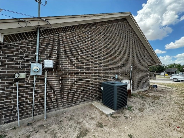 view of side of property featuring central air condition unit