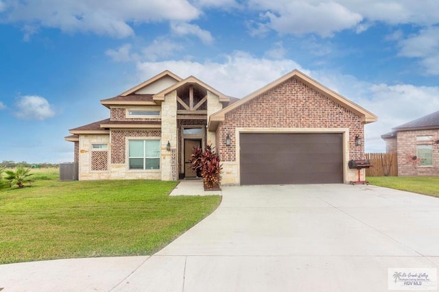 9753 Lake Arthur Ct, Los Fresnos, TX 78566 - view of front of home with stone siding, an attached garage, concrete driveway, and brick siding