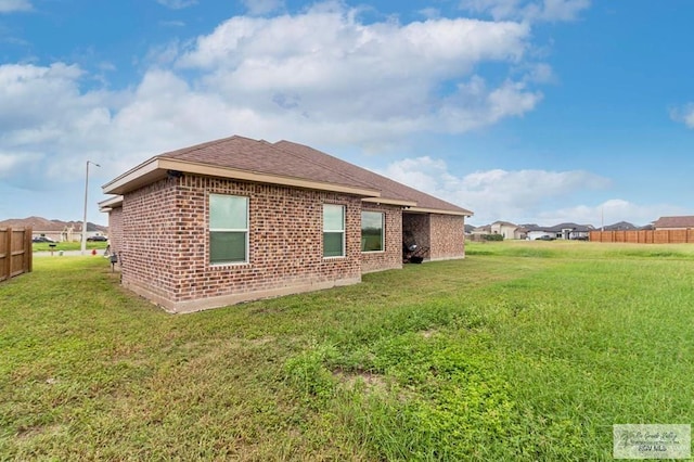 9753 Lake Arthur Ct, Los Fresnos, TX 78566 - back of property featuring brick siding and roof with shingles