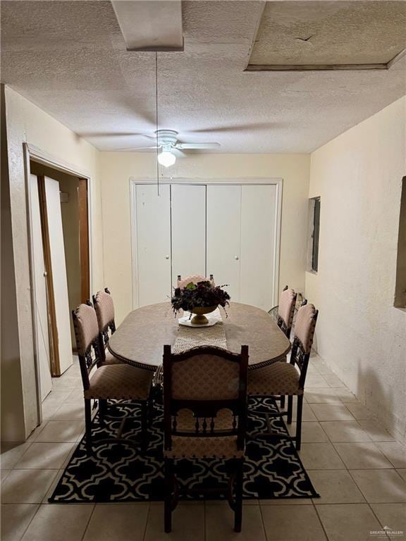 3813 N Taylor Rd, Mission, TX 78573 - dining space featuring light tile patterned flooring, a textured ceiling, and ceiling fan