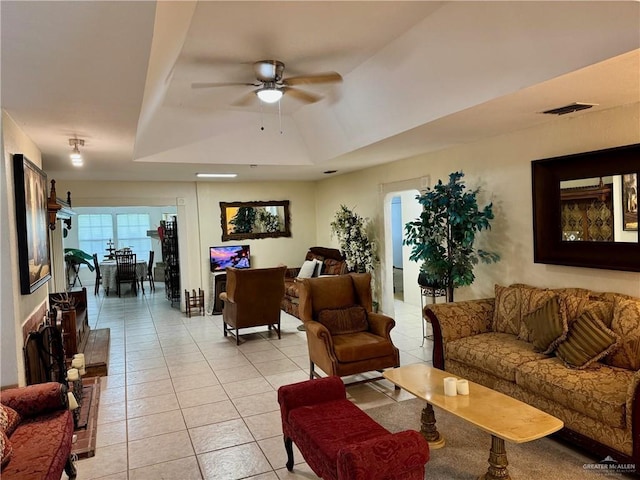 3813 N Taylor Rd, Mission, TX 78573 - living area featuring ceiling fan, light tile patterned floors, and a tray ceiling