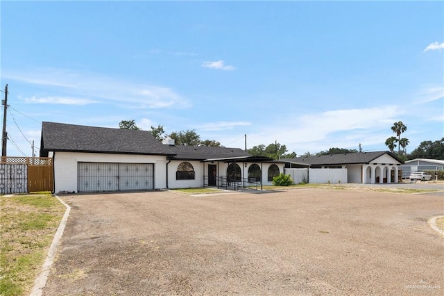 3813 N Taylor Rd, Mission, TX 78573 - view of front of house with a garage, driveway, and brick siding