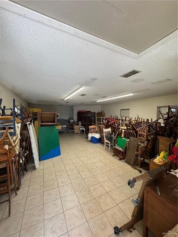 3813 N Taylor Rd, Mission, TX 78573 - misc room featuring a textured ceiling and light tile patterned flooring