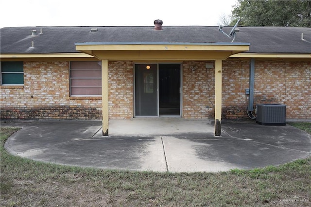 back of house featuring central AC and a patio area