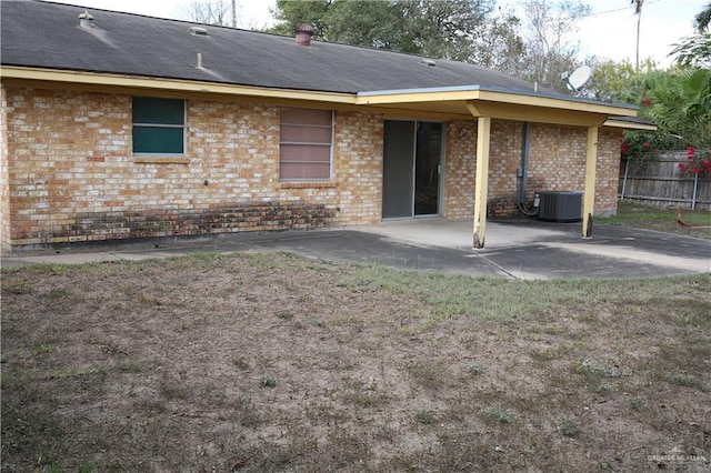 back of house with central AC unit and a patio area