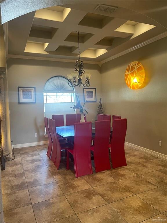 3104 Brightwood Ave, Edinburg, TX 78539 - tiled dining area featuring coffered ceiling, a chandelier, ornamental molding, baseboards, and beamed ceiling