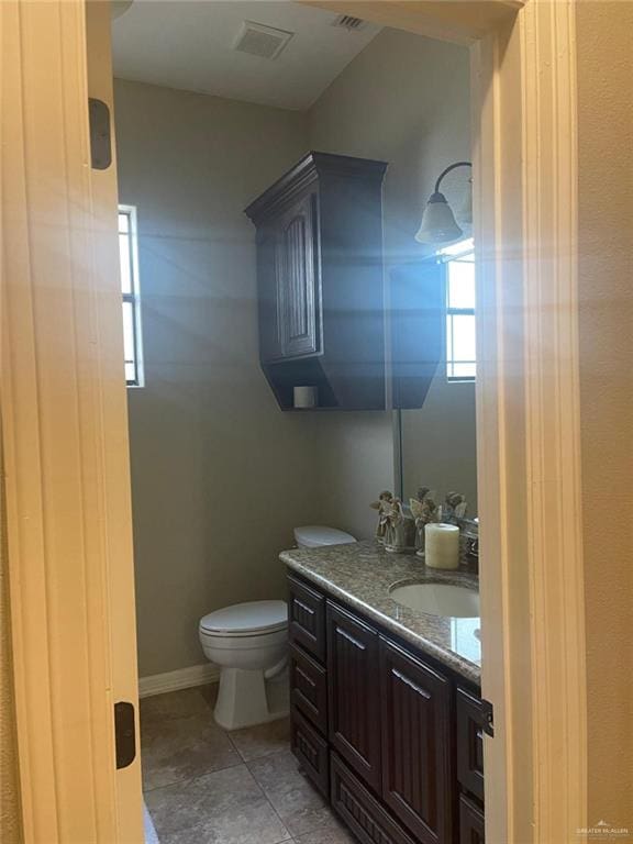 3104 Brightwood Ave, Edinburg, TX 78539 - bathroom featuring toilet, vanity, and healthy amount of natural light