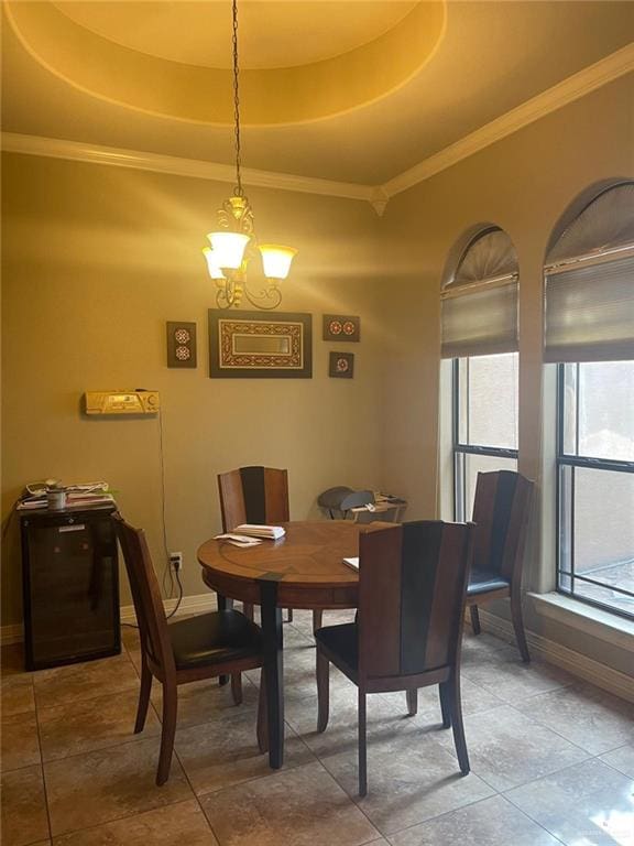 3104 Brightwood Ave, Edinburg, TX 78539 - dining room with a raised ceiling, baseboards, light tile patterned floors, crown molding, and a chandelier