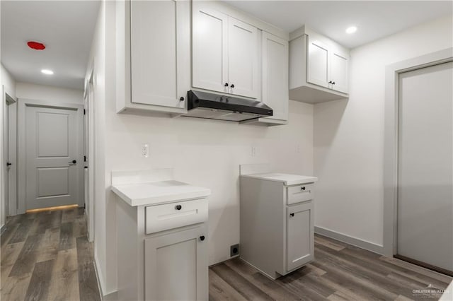 kitchen with white cabinetry and dark hardwood / wood-style floors