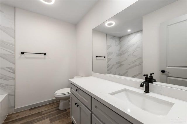 bathroom featuring hardwood / wood-style floors, vanity, and toilet