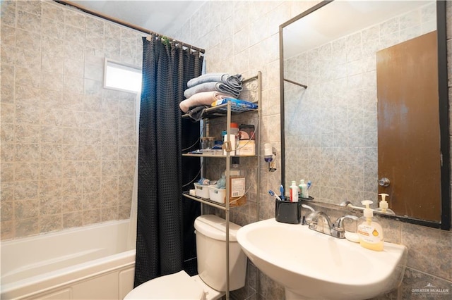 full bathroom featuring sink, tile walls, shower / tub combo with curtain, and toilet