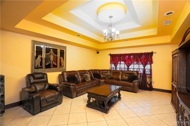 interior space with an inviting chandelier and a raised ceiling