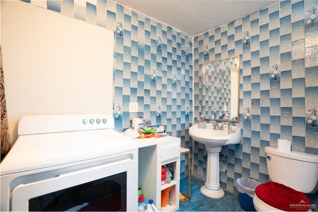 bathroom with tile patterned flooring and toilet