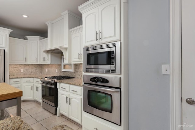 3222 Princess St, Edinburg, TX 78539 - kitchen with stainless steel appliances, tasteful backsplash, white cabinets, and recessed lighting