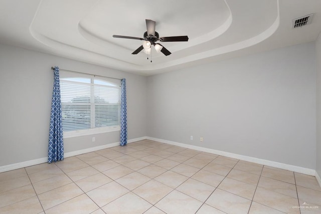 3222 Princess St, Edinburg, TX 78539 - unfurnished room with a raised ceiling, ceiling fan, and baseboards