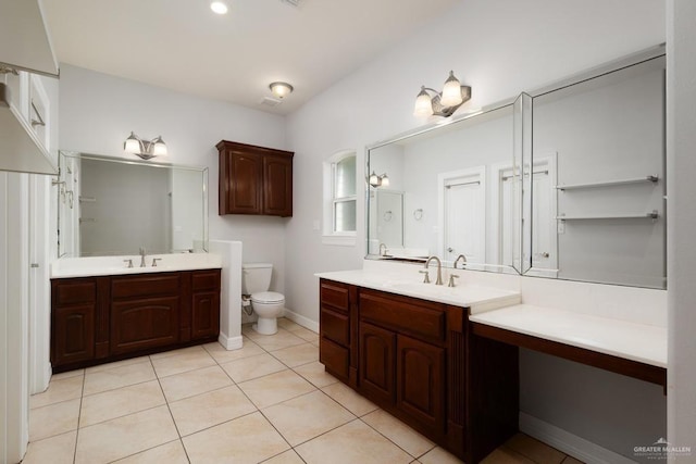 3222 Princess St, Edinburg, TX 78539 - bathroom with two vanities, tile patterned flooring, toilet, and baseboards