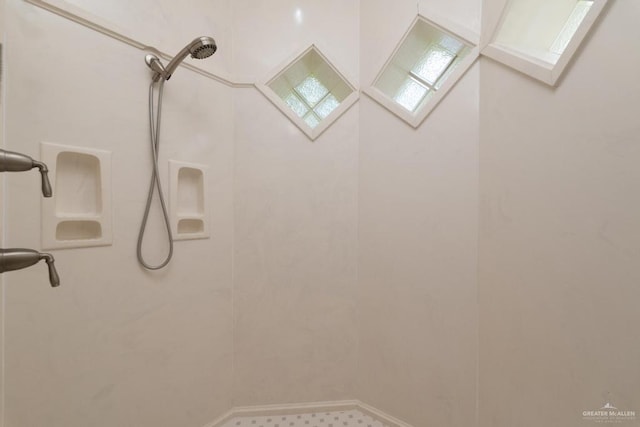 3222 Princess St, Edinburg, TX 78539 - bathroom with tiled shower, baseboards, and a skylight