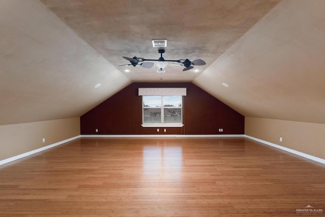 3222 Princess St, Edinburg, TX 78539 - additional living space with light wood-type flooring, ceiling fan, vaulted ceiling, and baseboards
