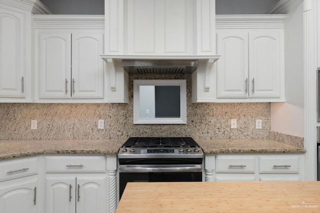3222 Princess St, Edinburg, TX 78539 - kitchen with stainless steel gas range, white cabinetry, and backsplash