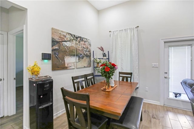 dining area featuring wood finished floors and baseboards