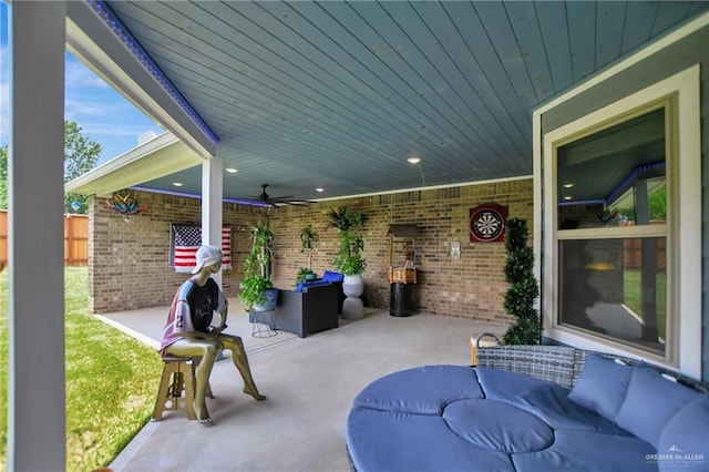 view of patio featuring an outdoor living space and ceiling fan