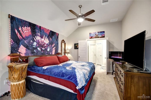 carpeted bedroom featuring ceiling fan and lofted ceiling