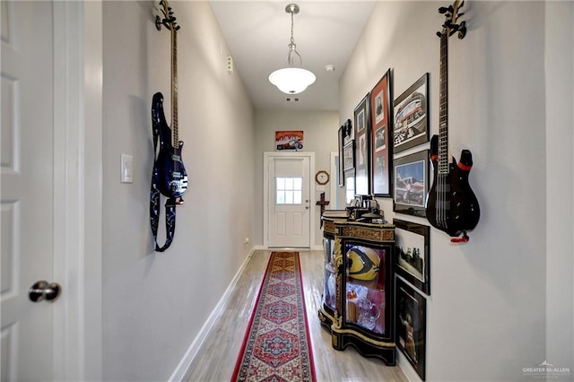 doorway with light hardwood / wood-style flooring