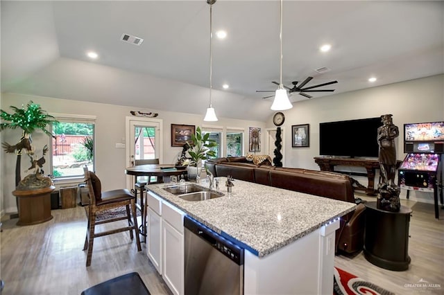 kitchen featuring dishwasher, sink, hanging light fixtures, a kitchen island with sink, and white cabinets