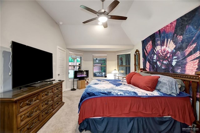 carpeted bedroom with ceiling fan and lofted ceiling