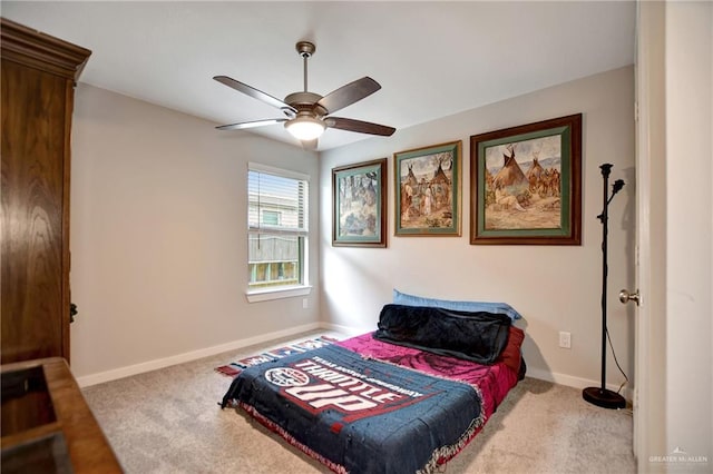 bedroom with ceiling fan and light colored carpet