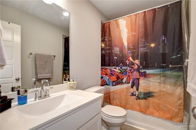 full bathroom featuring vanity, shower / bath combo, and toilet