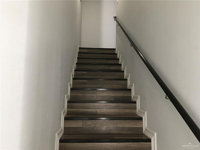 stairs with hardwood / wood-style floors