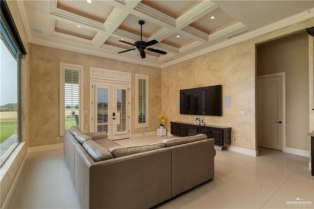 tiled living room featuring coffered ceiling, crown molding, ceiling fan, french doors, and beam ceiling