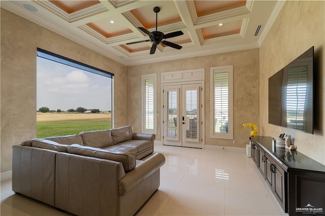 tiled living room with ceiling fan, coffered ceiling, crown molding, and beam ceiling