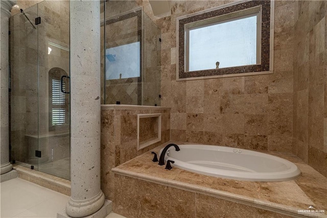 bathroom featuring decorative columns and independent shower and bath